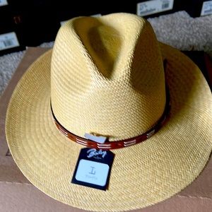 Straw hat size large 7 1/4 -7 3/8. Nice brown leather belt on top beautiful